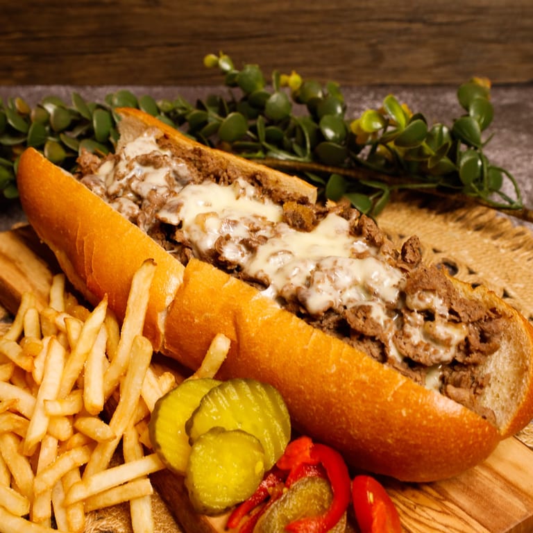 2 Cheesesteaks, Fries, 2-liter for $35